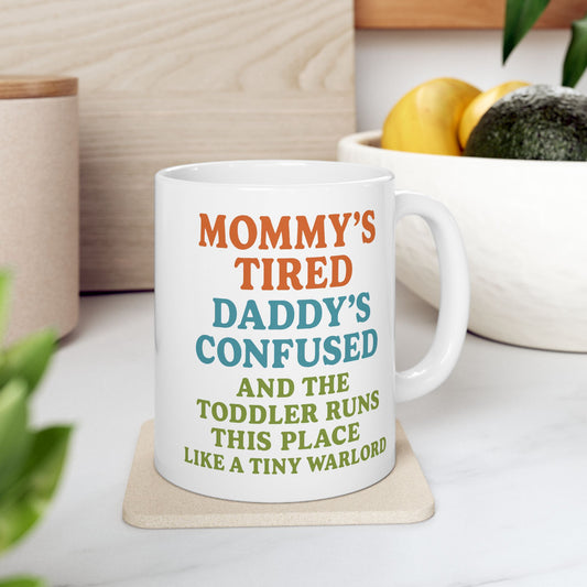 Mommy's Tired Daddy's Confused & The Toddler Runs This Place Like A Tiny Warlord Funny Hilarious Ceramic Coffee Mug by KD